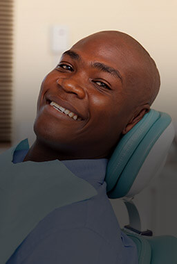 Happy man smiling in dental chair
