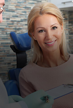 Smiling woman in dental chair