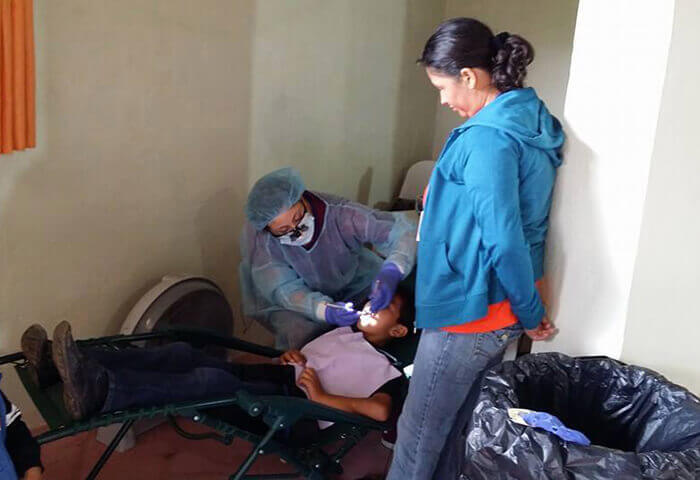 Team members working on young patient